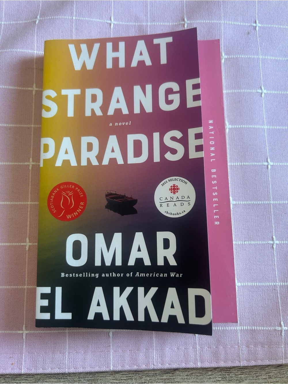 Omar El Akkad "What Strange Paradise" - Pink Gradient Paperback (English)